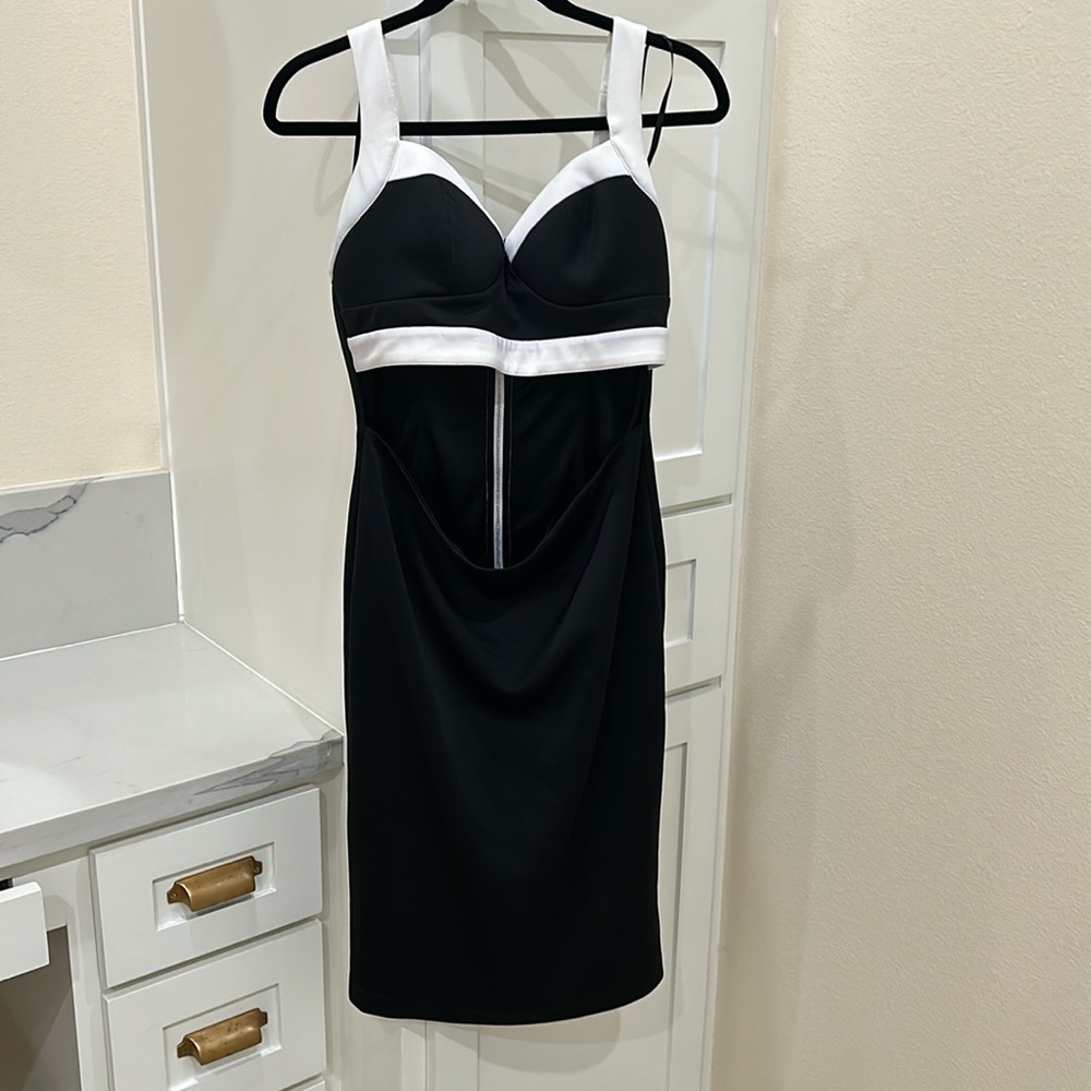 Beautiful black Bebe dress with open midriff.